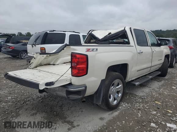 2014 Chevrolet Silverado 1500 LTZ with VIN 3GCUKSEC3EG231682, listed as a Copart auction lot 71015044 with 191,466 mi miles and Salvage title. Bid and sale history available at DreamBid. Image 3.