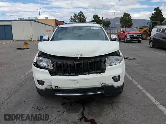 2012 Jeep Grand Cherokee Limited z VIN 1C4RJFBG0CC314672, wystawiony jako Copart lot #80743195 z przebiegiem 123 504 mil mil oraz Szkoda całkowita • Salvage title. Historia ofert i sprzedaży dostępna na DreamBid. Obrazek 14.