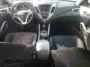 2014 Hyundai Veloster z VIN KMHTC6AD8EU194443, wystawiony jako Copart lot #60059565 z przebiegiem 201 848 mil mil oraz Szkoda całkowita • Salvage title. Historia ofert i sprzedaży dostępna na DreamBid. Obrazek 8.