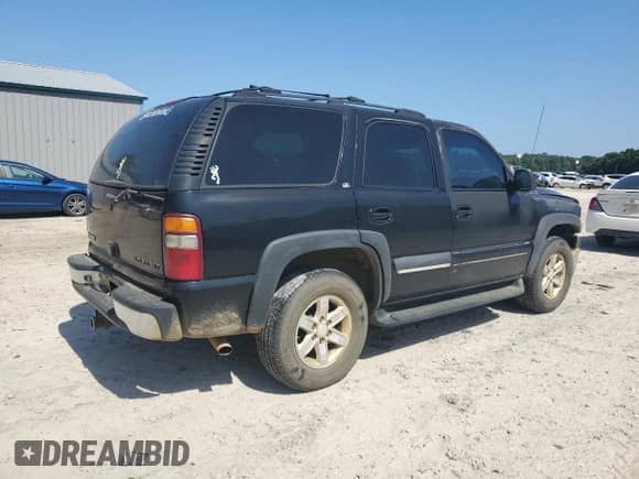 2002 Chevrolet Tahoe LS с VIN 1GNEC13ZX2R266452, выставлен на аукционе Copart как лот 64647615 с пробегом 339 078 миль миль и Списание • Salvage title. История ставок и продаж доступна на DreamBid. Изображение 3.