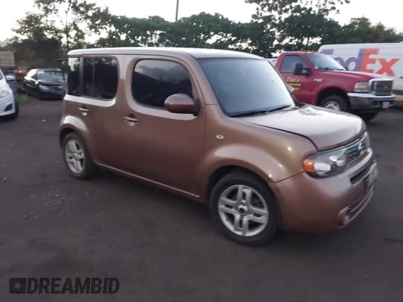 2011 Nissan Cube S z VIN JN8AZ2KR8BT200163, wystawiony jako IAAI lot #42898742 z przebiegiem 224 728 mil mil oraz . Historia ofert i sprzedaży dostępna na DreamBid. Obrazek 1.