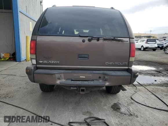 1999 Chevrolet Blazer LS with VIN 1GNDT13W3X2209981, listed as a Copart auction lot 84297504 with 226,641 mi miles and Salvage title. Bid and sale history available at DreamBid. Image 6.