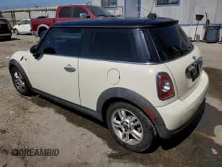 2013 MINI Hardtop with VIN WMWSU3C52DT680782, listed as a Copart auction lot 61779515 with 94,378 mi miles and Salvage title. Bid and sale history available at DreamBid. Image 2.
