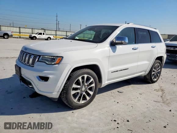 2017 Jeep Grand Cherokee Overland with VIN 1C4RJECG4HC965657, listed as a Copart auction lot 84400635 with 141,055 mi miles and Salvage title. Bid and sale history available at DreamBid. Image 1.