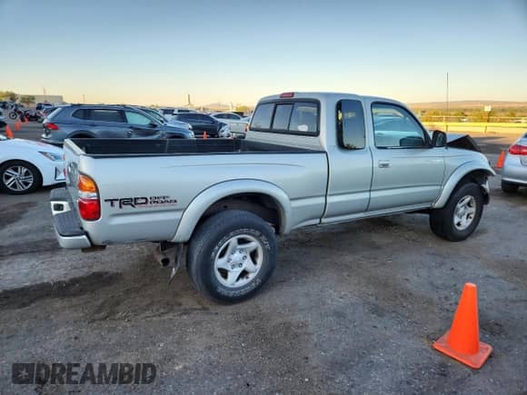 2003 Toyota Tacoma с VIN 5TEWN72NX3Z169900, выставлен на аукционе Copart как лот 80575545 с пробегом Не указан миль и Списание • Salvage title. История ставок и продаж доступна на DreamBid. Изображение 3.