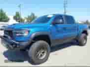 2024 Ram 1500 TRX with VIN 1C6SRFU95RN230215, listed as a IAAI auction lot 43197408 with 8,034 mi miles and . Bid and sale history available at DreamBid. Image 2.