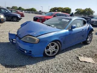 2004 Hyundai Tiburon GT с VIN KMHHN65F14U134711, выставлен на аукционе Copart как лот 62186845 с пробегом 186 632 миль миль и Списание • Salvage title. История ставок и продаж доступна на DreamBid. Изображение 1.