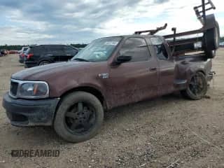 2000 Ford F-150 XL with VIN 1FTRX07W1YKA05317, listed as a Copart auction lot 56207955 with 282,785 mi miles and Salvage title. Bid and sale history available at DreamBid. Image 1.