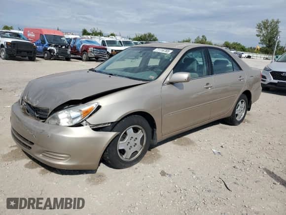 2002 Toyota Camry XLE with VIN 4T1BF32K42U025479, listed as a Copart auction lot 71116785 with 241,787 mi miles and Salvage title. Bid and sale history available at DreamBid. Image 1.