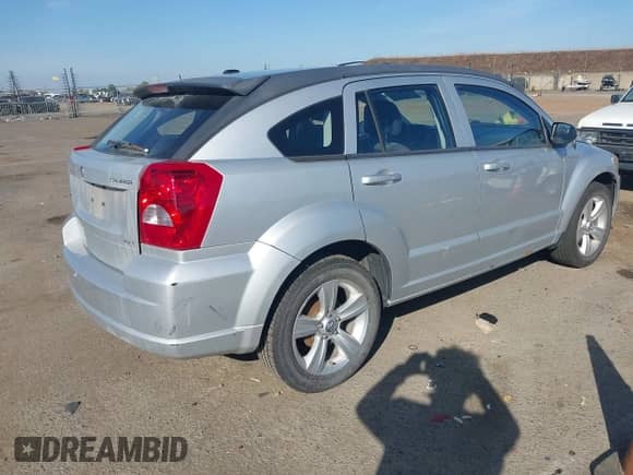 2010 Dodge Caliber SXT with VIN 1B3CB4HA4AD661148, listed as a IAAI auction lot 43507699 with 186,140 mi miles and . Bid and sale history available at DreamBid. Image 4.