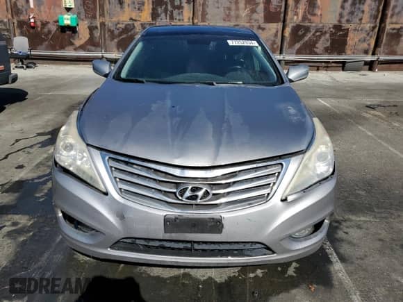2013 Hyundai Azera z VIN KMHFH4JGXDA245194, wystawiony jako Copart lot #77252934 z przebiegiem 128 712 mil mil oraz Czysty tytuł • Clean title. Historia ofert i sprzedaży dostępna na DreamBid. Obrazek 5.