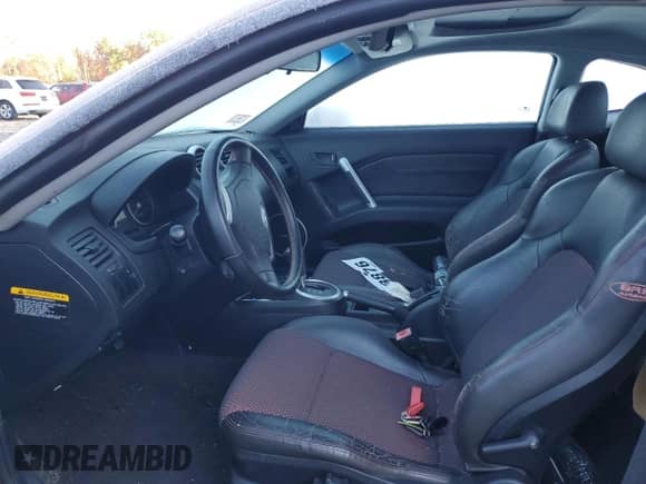 2005 Hyundai Tiburon GT с VIN KMHHN65F35U164178, выставлен на аукционе Copart как лот 76200274 с пробегом Не указан миль и Чистый • Clean title. История ставок и продаж доступна на DreamBid. Изображение 7.