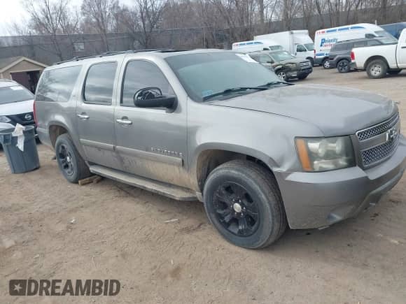 2007 Chevrolet Suburban LT z VIN 1GNFC16057R413155, wystawiony jako IAAI lot #41884665 z przebiegiem 205 038 mil mil oraz . Historia ofert i sprzedaży dostępna na DreamBid. Obrazek 1.