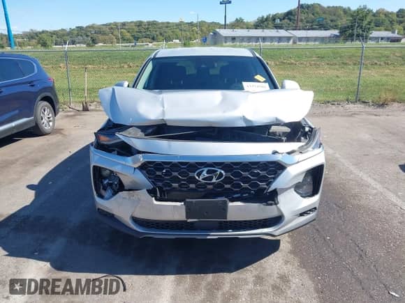 2019 Hyundai Santa Fe SE with VIN 5NMS23AD4KH100188, listed as a IAAI auction lot 43374582 with 88,759 mi miles and . Bid and sale history available at DreamBid. Image 12.