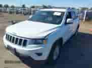 2014 Jeep Grand Cherokee Laredo with VIN 1C4RJFAG2EC283641, listed as a IAAI auction lot 43436412 with 195,041 mi miles and . Bid and sale history available at DreamBid. Image 2.