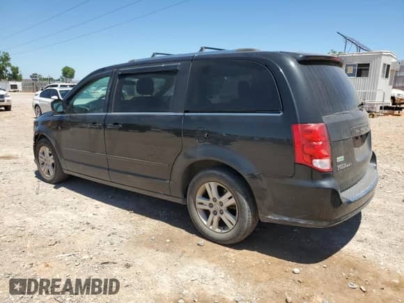 2013 Dodge Grand Caravan Crew with VIN 2C4RDGDG2DR700268, listed as a Copart auction lot 57086795 with 154,006 mi miles and Salvage title. Bid and sale history available at DreamBid. Image 2.