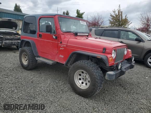 2001 Jeep Wrangler Sport with VIN 1J4FA49S11P339047, listed as a Copart auction lot 85923625 with 144,267 mi miles and Salvage title. Bid and sale history available at DreamBid. Image 4.