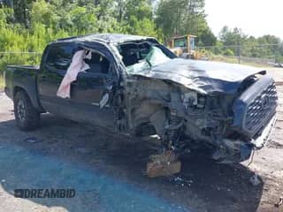 2023 Toyota Tacoma SR z VIN 3TMCZ5AN8PM600119, wystawiony jako IAAI lot #42605659 z przebiegiem 65 838 mil mil oraz . Historia ofert i sprzedaży dostępna na DreamBid. Obrazek 1.