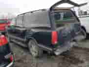 1997 Chevrolet Suburban with VIN 3GNFK16R5VG178674, listed as a Copart auction lot 80760694 with 248,492 mi miles and Salvage title. Bid and sale history available at DreamBid. Image 2.