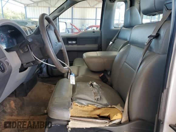 2007 Ford F-150 XL with VIN 1FTRF12207KC90491, listed as a Copart auction lot 84606995 with 141,490 mi miles and Salvage title. Bid and sale history available at DreamBid. Image 7.