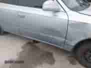 2003 Hyundai Accent GL z VIN KMHCG45C93U496234, wystawiony jako IAAI lot #38787449 z przebiegiem 191 590 mil mil oraz . Historia ofert i sprzedaży dostępna na DreamBid. Obrazek 14.