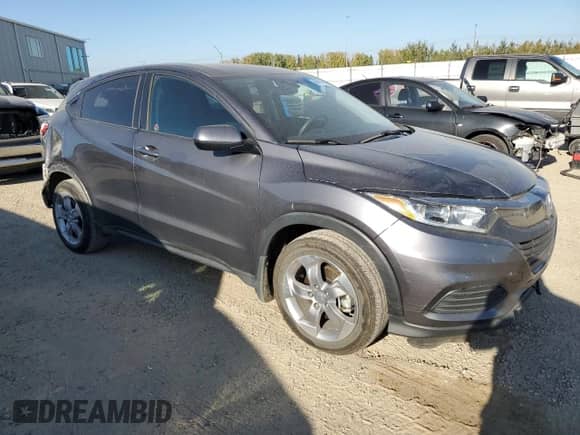 2020 Honda HR-V LX z VIN 3CZRU6H33LM106855, wystawiony jako Copart lot #80818165 z przebiegiem 67 974 mil mil oraz Szkoda całkowita • Salvage title. Historia ofert i sprzedaży dostępna na DreamBid. Obrazek 4.