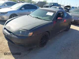 2005 Hyundai Tiburon GS с VIN KMHHM65D65U157713, выставлен на аукционе IAAI как лот 42039826 с пробегом 184 368 миль миль и . История ставок и продаж доступна на DreamBid. Изображение 2.