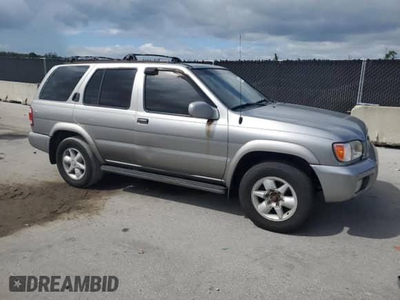 2001 Nissan Pathfinder SE with VIN JN8DR07Y21W502353, listed as a Copart auction lot 81490535 with 214,883 mi miles and Salvage title. Bid and sale history available at DreamBid. Image 4.