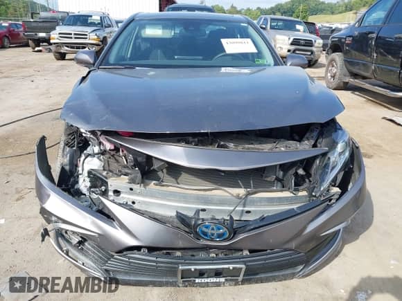 2021 Toyota Camry Hybrid LE with VIN 4T1H31AK0MU553127, listed as a IAAI auction lot 43099811 with 27,442 mi miles and . Bid and sale history available at DreamBid. Image 6.