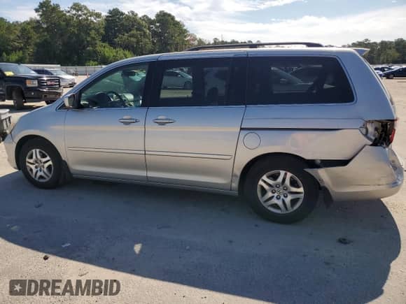 2005 Honda Odyssey EX z VIN 5FNRL38405B418106, wystawiony jako Copart lot #69424465 z przebiegiem 186 798 mil mil oraz Szkoda całkowita • Salvage title. Historia ofert i sprzedaży dostępna na DreamBid. Obrazek 2.
