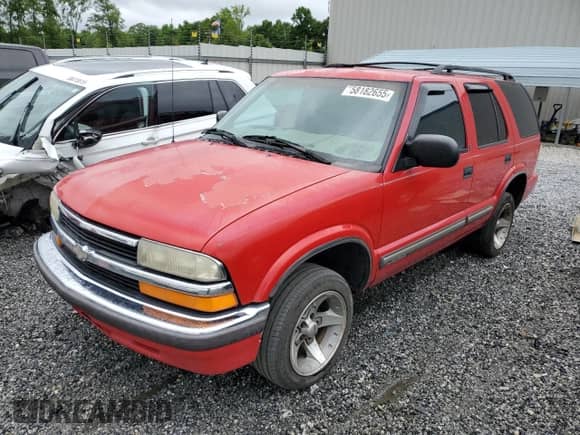 1999 Chevrolet Blazer LS z VIN 1GNCS13W7X2194643, wystawiony jako Copart lot #58182655 z przebiegiem 243 000 mil mil oraz Szkoda całkowita • Salvage title. Historia ofert i sprzedaży dostępna na DreamBid. Obrazek 1.