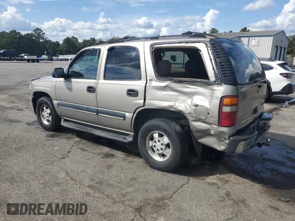 2002 Chevrolet Tahoe LT with VIN 1GNEC13Z02J101895, listed as a Copart auction lot 85274875 with 280,761 mi miles and Salvage title. Bid and sale history available at DreamBid. Image 2.