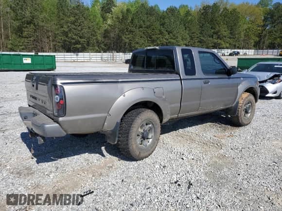 2004 Nissan Frontier XE Desert Runner with VIN 1N6ED26Y24C429693, listed as a Copart auction lot 52411095 with 216,430 mi miles and Salvage title. Bid and sale history available at DreamBid. Image 3.