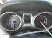 2014 Dodge Journey SE with VIN 3C4PDCAB5ET310739, listed as a Copart auction lot 69391595 with 128,134 mi miles and Salvage title. Bid and sale history available at DreamBid. Image 9.