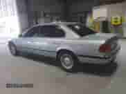 1997 BMW 7 Series 740iL with VIN WBAGJ8321VDM03554, listed as a Copart auction lot 71351095 with 143,449 mi miles and Salvage title. Bid and sale history available at DreamBid. Image 2.