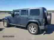 2007 Jeep Wrangler Unlimited Sahara z VIN 1J4GA591X7L147255, wystawiony jako Copart lot #82341025 z przebiegiem 189 755 mil mil oraz Czysty tytuł • Clean title. Historia ofert i sprzedaży dostępna na DreamBid. Obrazek 2.