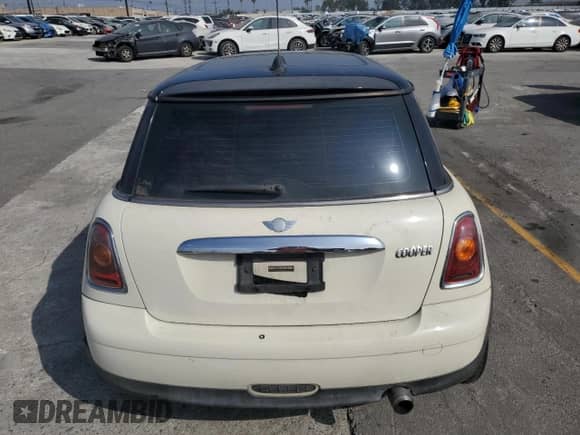 2007 MINI Hardtop with VIN WMWMF33547TT51590, listed as a Copart auction lot 57323995 with 114,113 mi miles and Salvage title. Bid and sale history available at DreamBid. Image 6.