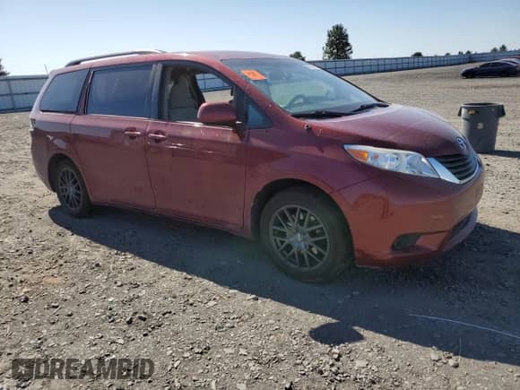 2014 Toyota Sienna LE with VIN 5TDJK3DC5ES093932, listed as a Copart auction lot 63611985 with 142,044 mi miles and Salvage title. Bid and sale history available at DreamBid. Image 4.