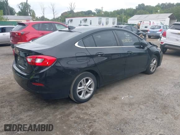 2018 Chevrolet Cruze LT with VIN 1G1BE5SM6J7148176, listed as a IAAI auction lot 43185932 with 122,707 mi miles and . Bid and sale history available at DreamBid. Image 4.