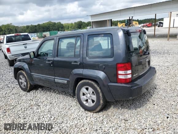 2011 Jeep Liberty Sport with VIN 1J4PN2GK7BW560109, listed as a Copart auction lot 82042155 with 145,599 mi miles and Salvage title. Bid and sale history available at DreamBid. Image 2.