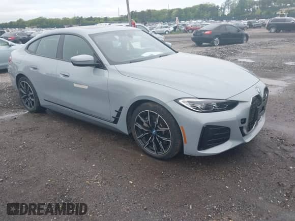 2022 BMW i4 eDrive40 with VIN WBY73AW00NFN14842, listed as a IAAI auction lot 42313404 with 23,556 mi miles and . Bid and sale history available at DreamBid. Image 1.
