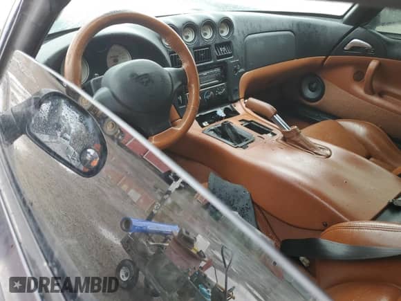 1999 Dodge Viper RT/10 с VIN 1B3ER65E0XV504078, выставлен на аукционе Copart как лот 54338855 с пробегом Не указан миль и На запчасти • Non repairable. История ставок и продаж доступна на DreamBid. Изображение 8.