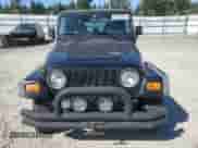 1997 Jeep Wrangler Sport with VIN 1J4FY19S0VP543158, listed as a Copart auction lot 80878565 with 301,693 mi miles and Salvage title. Bid and sale history available at DreamBid. Image 5.