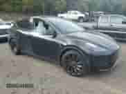 2023 Tesla Model Y Performance with VIN 7SAYGDEF0PF808883, listed as a Copart auction lot 82106605 with 22,706 mi miles and Salvage title. Bid and sale history available at DreamBid. Image 4.