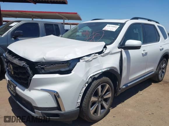 2023 Honda Pilot Touring с VIN 5FNYG2H70PB002497, выставлен на аукционе IAAI как лот 42676885 с пробегом 33 829 миль миль и . История ставок и продаж доступна на DreamBid. Изображение 6.