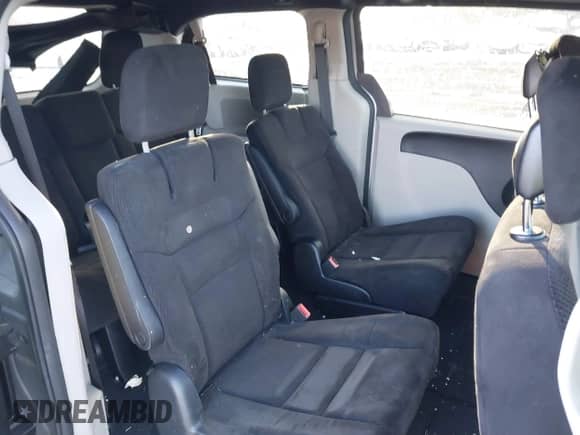 2014 Dodge Grand Caravan American Value with VIN 2C4RDGBG8ER376831, listed as a IAAI auction lot 41379809 with 142,101 mi miles and . Bid and sale history available at DreamBid. Image 8.