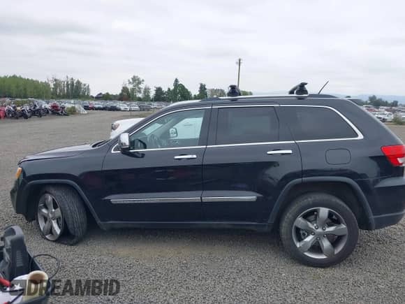 2013 Jeep Grand Cherokee Limited z VIN 1C4RJFBT4DC503856, wystawiony jako IAAI lot #43166356 z przebiegiem 143 262 mil mil oraz . Historia ofert i sprzedaży dostępna na DreamBid. Obrazek 14.