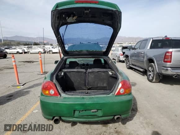 2004 Hyundai Tiburon GT с VIN KMHHN65F74U129996, выставлен на аукционе Copart как лот 43359015 с пробегом 231 277 миль миль и Списание • Salvage title. История ставок и продаж доступна на DreamBid. Изображение 6.