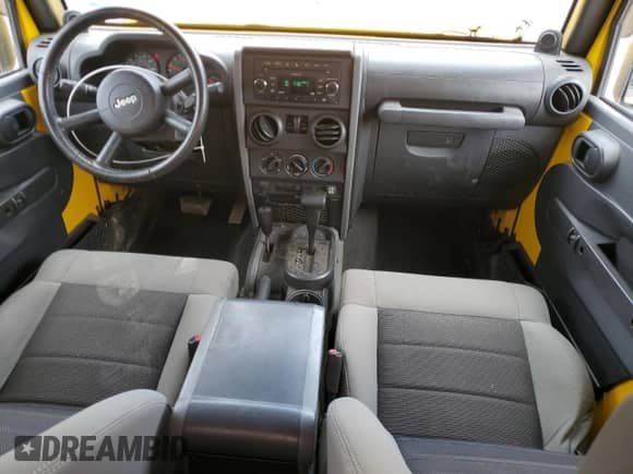 2009 Jeep Wrangler X with VIN 1J4FA24169L772059, listed as a Copart auction lot 69388315 with 234,232 mi miles and Salvage title. Bid and sale history available at DreamBid. Image 8.