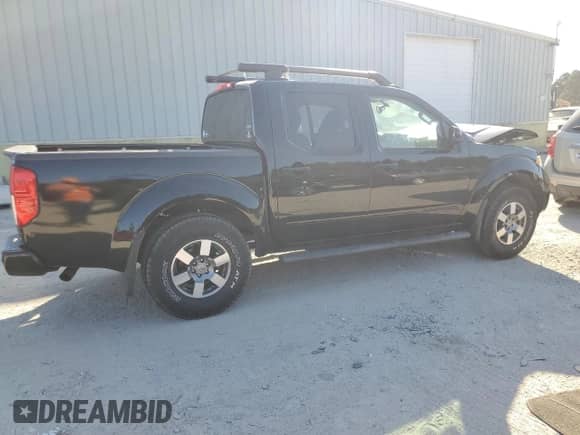 2013 Nissan Frontier Pro-4X с VIN 1N6AD0EV8DN753486, выставлен на аукционе Copart как лот 77250244 с пробегом 113 351 миль миль и Списание • Salvage title. История ставок и продаж доступна на DreamBid. Изображение 3.